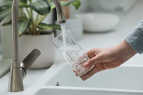 Cliff Cummings Water Services - Filling glass of water